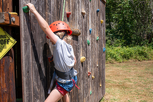 Girl on the climbing wall