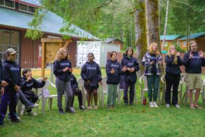 Group of Compass campers singing at morning gathering